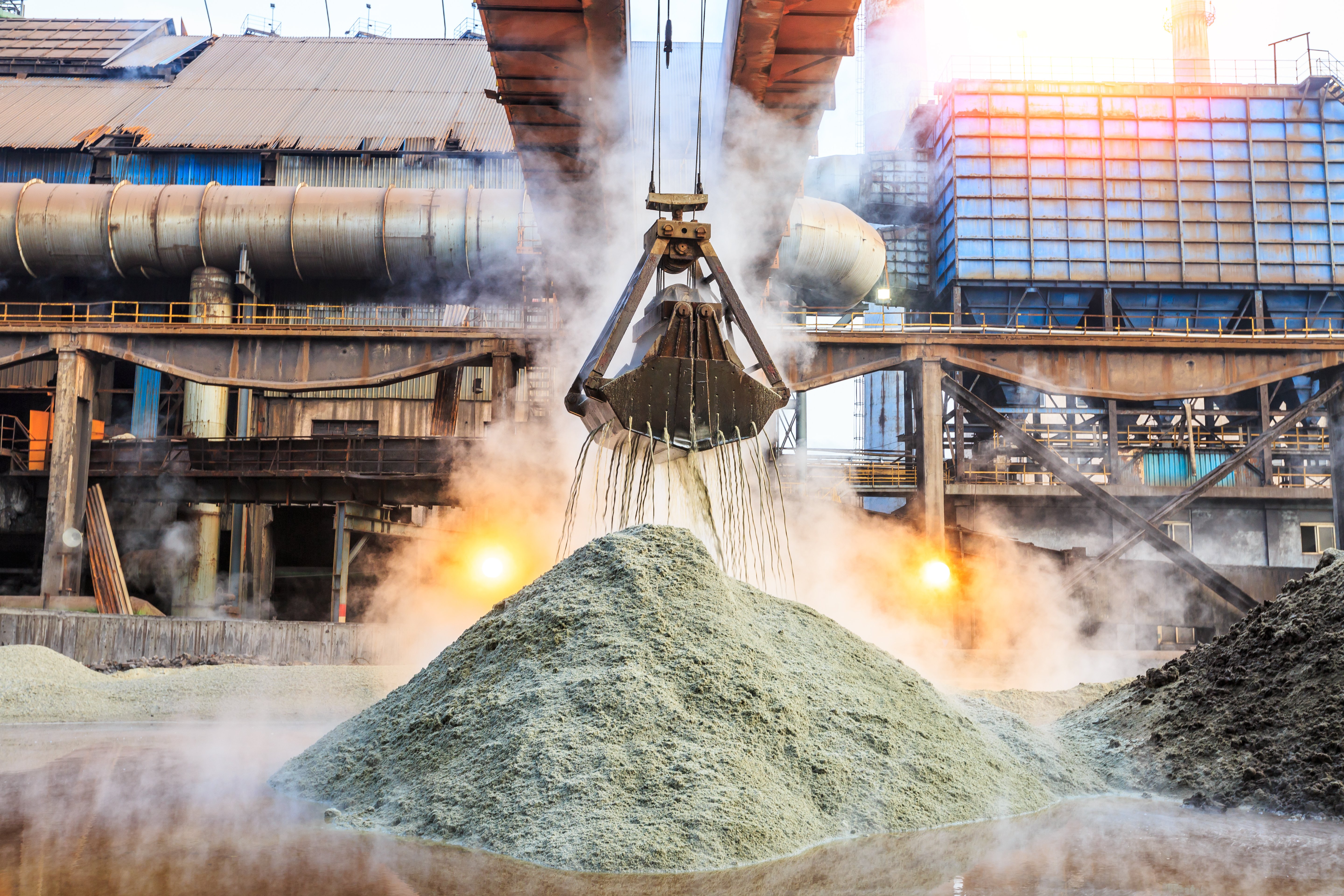 industrial-extractor-over-sand-pile-at-factory-2026-03-26-06-06-47-utc